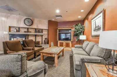 a living room with couches and a fireplace at 8179 Silver Mill condo in Keystone
