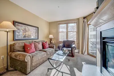 a living room with a couch and a tv at 8179 Silver Mill condo in Keystone