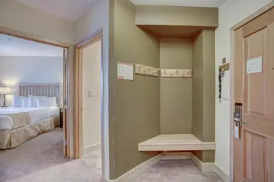 a bedroom with a bed and a walk in closet at 8231 Silver Mill condo in Keystone