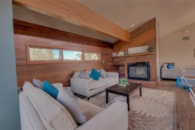 a living room with two couches and a fireplace at Cozy Ski Condo + Hot Tub + Fireplace + Heated Pool in Silverthorne