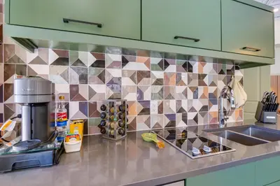 a kitchen counter with a sink and a tiled wall at Ski Shuttle Access Studio 2 Mi to Keystone Slopes in Keystone