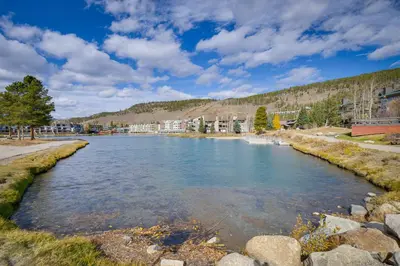 a river in a city with buildings in the background at Ski Shuttle Access Studio 2 Mi to Keystone Slopes in Keystone
