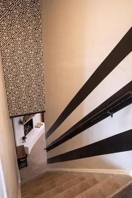 a staircase in a room with a wall at Rocky Mountain Haven-Modern 2BD, 1BA Basement Retreat in Lakewood in Lakewood