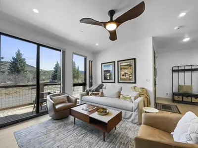 a living room with a couch and a ceiling fan at 541 Center Circle 3Br 3,5Ba townhouse in Silverthorne