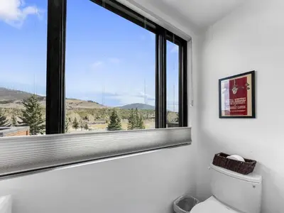 a bathroom with a large window and a toilet at 541 Center Circle 3Br 3,5Ba townhouse in Silverthorne