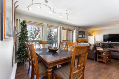a dining room with a table and chairs at 1076 Wild Irishman condo in Keystone
