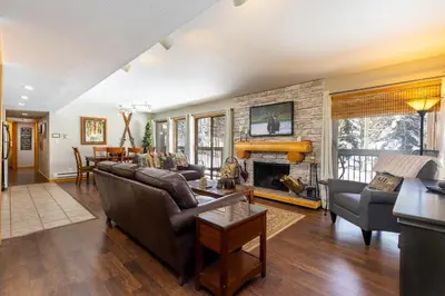 a living room with a couch and a fireplace at 1076 Wild Irishman condo in Keystone