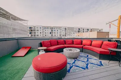 a red couch sitting on top of a roof at Golden Triangle Townhome at Downtown Denver in Denver