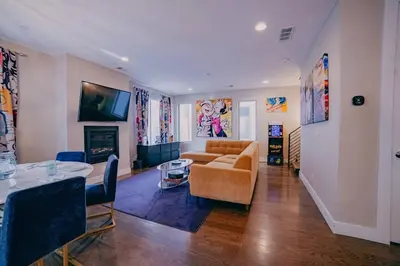 a living room with a couch and a table at Golden Triangle Townhome at Downtown Denver in Denver