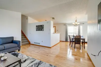 a living room with a blue couch and a table at Patio, Grill, Yard Pet-Friendly Denver Home! in Aurora
