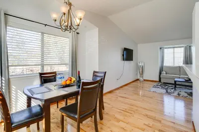 a dining room and living room with a table and chairs at Patio, Grill, Yard Pet-Friendly Denver Home! in Aurora
