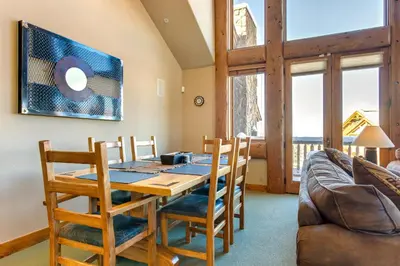 a dining room with a table and chairs and a couch at Spacious Fraser Gem 7 Mi to Winter Park! in Fraser