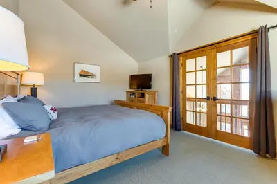 a bedroom with a bed and a tv and a window at Spacious Fraser Gem 7 Mi to Winter Park! in Fraser