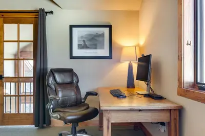 a office with a desk with a chair and a computer at Spacious Fraser Gem 7 Mi to Winter Park! in Fraser