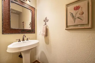 a bathroom with a sink and a mirror at Fall River Retreat - Monthly Long-Term Vacation Rental townhouse in Estes Park