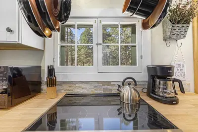 a kitchen with a tea kettle on a counter at Niwot Cabin - Stay in Rocky Mountain National Park - Estes Park - NEW LISTING - 22-ZONE3298 cabin in Estes Park