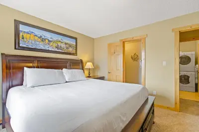 a bedroom with a large white bed in a room at Rocky Mountain Escape with Vista View - Wildernest in Silverthorne