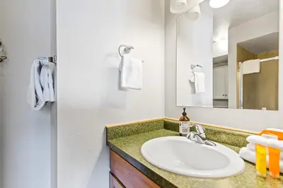 a bathroom with a sink and a mirror at Rocky Mountain Escape with Vista View - Wildernest in Silverthorne