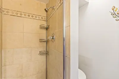 a shower with a glass door in a bathroom at Rocky Mountain Escape with Vista View - Wildernest in Silverthorne