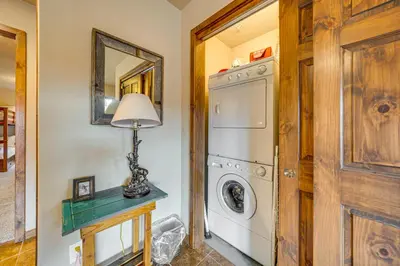 a laundry room with a washer and dryer at 6 Mi to Winter Park Resort Townhome with Hot Tub! in Fraser