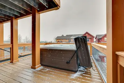 a hot tub on the deck of a house at 6 Mi to Winter Park Resort Townhome with Hot Tub! in Fraser