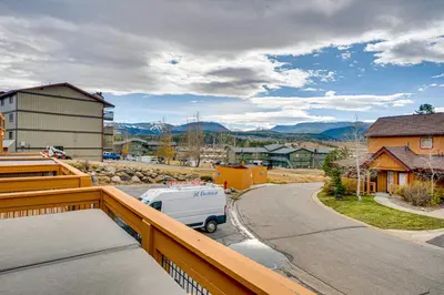 a view from the balcony of a house with a van at 6 Mi to Winter Park Resort Townhome with Hot Tub! in Fraser