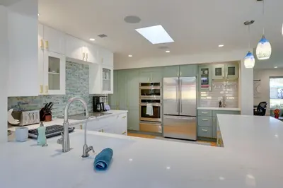 a kitchen with white counters and stainless steel appliances at Private Hot Tub and Sauna Saulsbury Guest House in Wheat Ridge