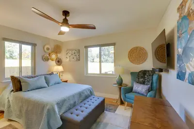 a bedroom with a bed and a couch and a chair at Private Hot Tub and Sauna Saulsbury Guest House in Wheat Ridge