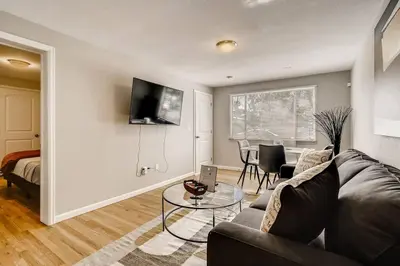 a living room with a couch and a table at Close to Denver & Golden - Perfect for Groups in Arvada