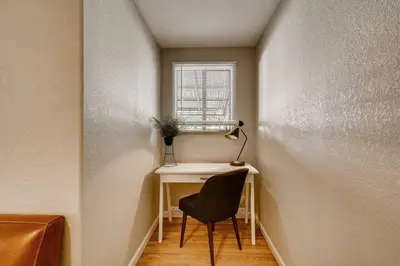 a room with a desk with a chair and a window at Close to Denver & Golden - Perfect for Groups in Arvada