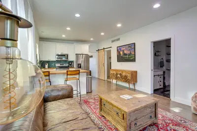 a living room with a couch and a table at Cozy and Pet-Friendly Home - 3 Mi to Downtown Denver in Denver