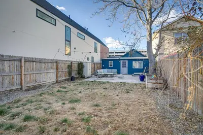 a backyard with a fence and a house at Cozy and Pet-Friendly Home - 3 Mi to Downtown Denver in Denver