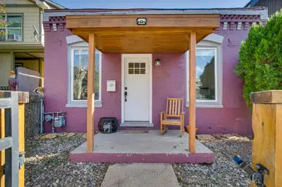 a pink house with a wooden gazebo at Cozy and Pet-Friendly Home - 3 Mi to Downtown Denver in Denver