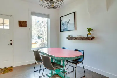 a dining room with a table and chairs at Cozy and Pet-Friendly Home - 3 Mi to Downtown Denver in Denver