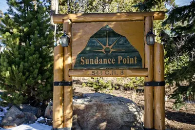 a sign for the entrance to a wilderness point at Sundance Mountain Retreat in Fraser