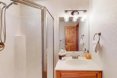 a bathroom with a sink and a shower at Sundance Mountain Retreat in Fraser