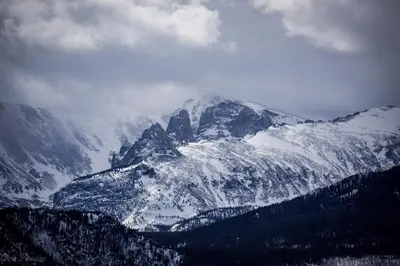 a snow covered mountain with trees in front of it at Show Me Mountain Views -- 20-NCD0130 home in Estes Park