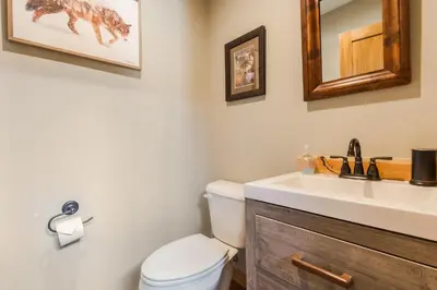 a bathroom with a white toilet and a sink at Show Me Mountain Views -- 20-NCD0130 home in Estes Park