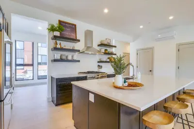 a kitchen with a large island with a counter top at Ski, Hike and Relax Fireside Silverthorne Getaway! in Silverthorne