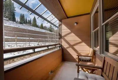 a room with a window with a view of a snowy field at Premium Unit 1307 - 1 Bedroom - Zephyr Mountain condo in Winter Park