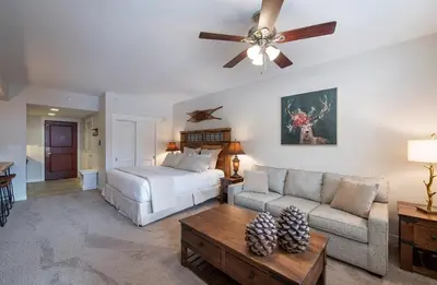 a living room with a bed and a couch at Premium Unit 4643- Fraser Crossing Founders Pointe condo in Winter Park
