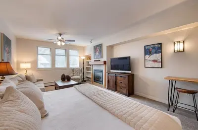 a large living room with a bed and a tv at Premium Unit 4643- Fraser Crossing Founders Pointe condo in Winter Park