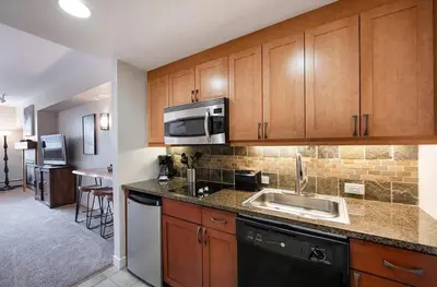 a kitchen with a sink and a microwave at Premium Unit 4643- Fraser Crossing Founders Pointe condo in Winter Park