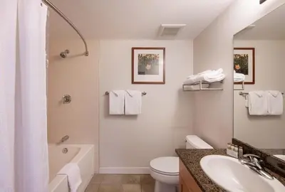 a bathroom with a sink and a toilet and a tub at Premium Unit 4643- Fraser Crossing Founders Pointe condo in Winter Park