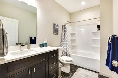 a bathroom with a sink and a toilet and a shower at Ski-InandSki-Out Granby Getaway with Fire Pit! in Granby