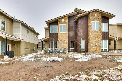 a house under construction with a yard at Ski-InandSki-Out Granby Getaway with Fire Pit! in Granby