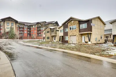 an empty street in front of some apartment buildings at Ski-InandSki-Out Granby Getaway with Fire Pit! in Granby
