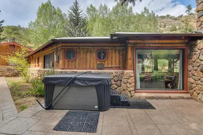 a small house with a television in a yard at Charming Idaho Springs Retreat on Chicago Creek! in Idaho Springs