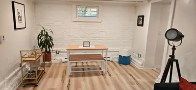 a room with a desk and a camera in it at 2-Bedroom in the Heart of Denver in Denver