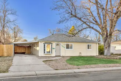 a house with a bird on the roof of it at Spacious home near Anschutz/DIA in Aurora